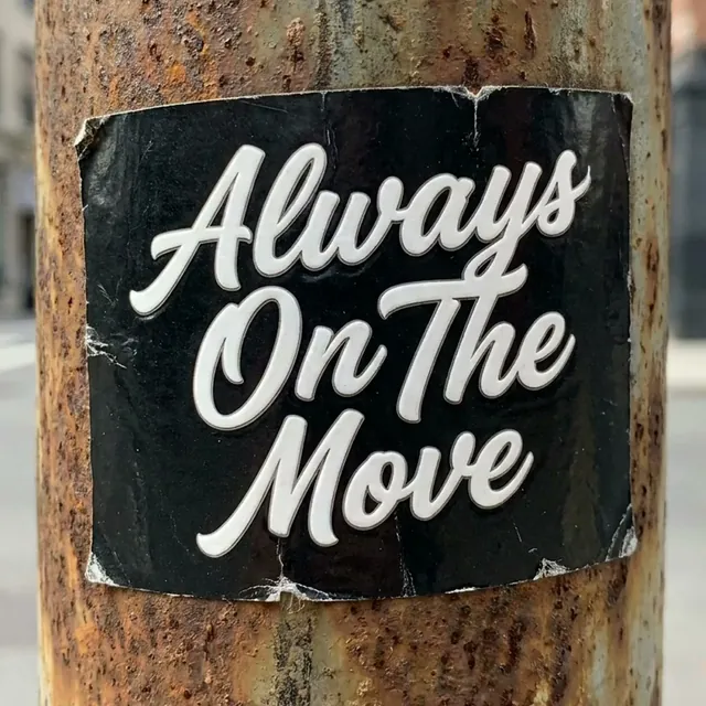 Text printed on a street sticker slapped onto a wall in a fast-paced clip